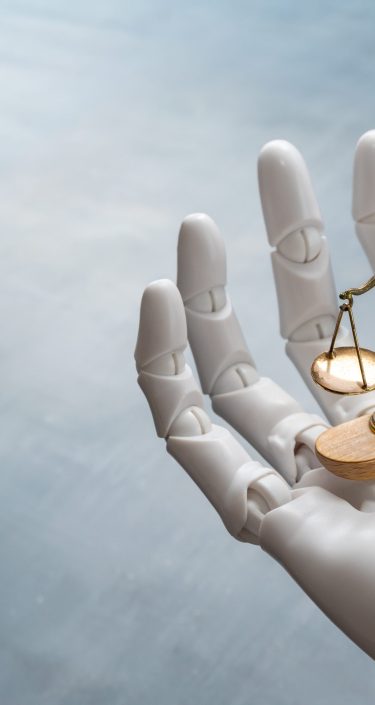 AI and regulation in 2026 represented by a hand a scale